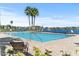 A resort-style community pool offers relaxation with tranquil lake views at 118 Grande Belfly Way, Daytona Beach, FL 32124