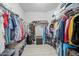 Spacious walk-in closet with organized shelving and ample storage space for clothing and accessories at 118 Grande Belfly Way, Daytona Beach, FL 32124