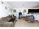 Living room featuring couches, tile floors, and a TV set at 1183 Honey Blossom Dr, Orlando, FL 32824