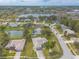 Aerial view showcases the neighborhood with beautiful landscaping, community ponds, and well-kept homes at 134 Deskin Dr, South Daytona, FL 32119