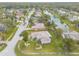 Features a lovely neighborhood with lush landscaping, a serene pond, and well-maintained houses at 134 Deskin Dr, South Daytona, FL 32119