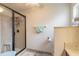Bathroom with tiled shower and glass door, featuring ceramic tile flooring at 134 Deskin Dr, South Daytona, FL 32119