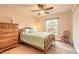 Cozy bedroom features wood-look vinyl flooring, and a large, bright window at 134 Deskin Dr, South Daytona, FL 32119