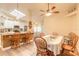 Dining area adjacent to kitchen with views to the living and breakfast areas at 134 Deskin Dr, South Daytona, FL 32119