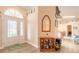 Bright entryway with decorative glass door, wood floors, and transom window at 134 Deskin Dr, South Daytona, FL 32119