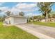 Spacious two car garage with extended driveway and manicured lawn at 134 Deskin Dr, South Daytona, FL 32119
