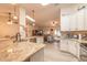 Kitchen with island and stainless appliances flowing into the living area at 134 Deskin Dr, South Daytona, FL 32119