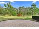 Picture of lush, landscaped backyard featuring stone patio with perimeter garden at 1341 Hayton Ave, Deland, FL 32724