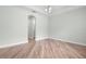 Spacious bedroom features wood floors, an arched doorway, and fresh neutral paint at 1341 Hayton Ave, Deland, FL 32724