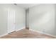 Empty bedroom with wood-look floors and white doors at 1341 Hayton Ave, Deland, FL 32724