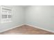 Empty bedroom with wood-look floors and bright window at 1341 Hayton Ave, Deland, FL 32724
