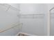 Walk-in closet featuring wire shelving and a wooden hanging rod with mirror at 1341 Hayton Ave, Deland, FL 32724