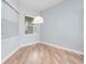 Cozy dining nook featuring bright light from the windows and light hardwood flooring at 1341 Hayton Ave, Deland, FL 32724