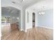 Open concept dining room featuring wood flooring, recessed lights, and backyard view at 1341 Hayton Ave, Deland, FL 32724