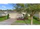 Inviting single-Gathering home with manicured landscaping, a two-car garage, and a brick walkway at 1341 Hayton Ave, Deland, FL 32724