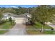 Beautifully landscaped single-Gathering home featuring a two-car garage and brick driveway at 1341 Hayton Ave, Deland, FL 32724
