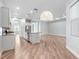 Open kitchen features a granite island, stainless appliances, and seamless access to the living area at 1341 Hayton Ave, Deland, FL 32724