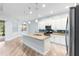 Bright kitchen featuring an island, stainless steel appliances and open access to the dining area at 1341 Hayton Ave, Deland, FL 32724