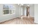Bright and airy living room with new floors, natural light, and modern light fixture at 1341 Hayton Ave, Deland, FL 32724