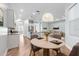 Open floor plan with wood flooring, updated kitchen, and casual dining area at 1341 Hayton Ave, Deland, FL 32724