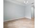 Spacious living room showcasing tray ceiling and wood-look flooring at 1341 Hayton Ave, Deland, FL 32724