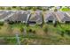 Aerial view of backyards featuring a screened patio, and landscaped yard at 1341 Hayton Ave, Deland, FL 32724