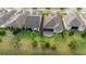 Aerial view of backyard featuring a screened patio, and landscaped yard at 1341 Hayton Ave, Deland, FL 32724
