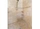 Updated shower features tile walls, mosaic accents, corner shelves, and a rainfall shower head at 1341 Hayton Ave, Deland, FL 32724
