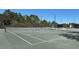 Well-maintained tennis court with new nets and a comfortable seating area at 1341 Hayton Ave, Deland, FL 32724