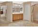Bathroom featuring a vanity with generous storage, tile flooring, and easy access to both closet and shower at 1491 W Silver Hammock, Deland, FL 32720