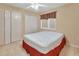 Bedroom featuring dual closets, complemented by soft carpet flooring and a ceiling fan for added comfort and storage at 1491 W Silver Hammock, Deland, FL 32720