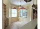 Sunny breakfast nook with large windows, built-in cabinets, and a ceiling fan at 1491 W Silver Hammock, Deland, FL 32720