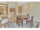 Dining room with wooden table set and adjacent to the kitchen, perfect for entertaining at 1491 W Silver Hammock, Deland, FL 32720