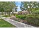 Attractive home featuring lush landscaping, mature trees, and a welcoming entrance at 1491 W Silver Hammock, Deland, FL 32720
