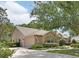 Charming single-story home featuring a well-manicured lawn, a two-car garage, and a welcoming entrance at 1491 W Silver Hammock, Deland, FL 32720