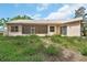 Exterior of home featuring a screened porch with multiple windows overlooking the backyard at 1491 W Silver Hammock, Deland, FL 32720