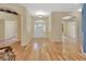 Inviting foyer with hardwood floors, arched doorways, and a decorative front door at 1491 W Silver Hammock, Deland, FL 32720