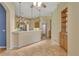 Open concept kitchen with breakfast bar, stainless steel appliances and light wood cabinetry at 1491 W Silver Hammock, Deland, FL 32720