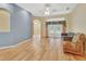 Bright living room with hardwood floors, french doors, and neutral walls at 1491 W Silver Hammock, Deland, FL 32720
