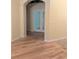 Living room featuring hardwood flooring and arched doorway at 1491 W Silver Hammock, Deland, FL 32720