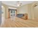 Bright living room featuring hardwood floors, neutral walls, and a backyard view at 1491 W Silver Hammock, Deland, FL 32720