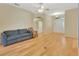 Spacious living room featuring hardwood floors, arched doorway, and an inviting entrance at 1491 W Silver Hammock, Deland, FL 32720