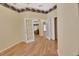 Office featuring French doors and hardwood floors, complemented by decorative border and paint at 1491 W Silver Hammock, Deland, FL 32720