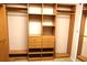 Spacious walk-in closet featuring custom shelving, drawers, and ample hanging space for organized storage at 1491 W Silver Hammock, Deland, FL 32720
