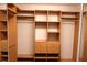 Custom walk-in closet with multiple shelving units, drawers, and rods to maximize storage and organization at 1491 W Silver Hammock, Deland, FL 32720