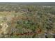 Aerial perspective of a heavily forested property surrounded by a lush green landscape, nature's embrace at 1712 Alanson Dr, Deland, FL 32724