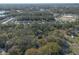 An aerial view showing the mature trees and wooded lot with the convenience of a nearby community of homesites at 1712 Alanson Dr, Deland, FL 32724