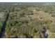 A high aerial view shows this private wooded homesite surrounded by nature and nearby community of homesites at 1712 Alanson Dr, Deland, FL 32724
