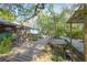 Backyard oasis featuring a gazebo, koi pond, wooden deck, and two chairs for enjoying the serene outdoors at 1712 Alanson Dr, Deland, FL 32724