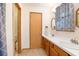Bathroom boasts double sink vanity with generous countertop space and a wood cabinet at 1712 Alanson Dr, Deland, FL 32724